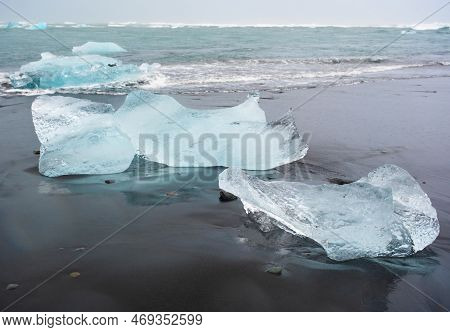 Diamond Beach In Iceland. Incredible Landscape With Pure Blue Icebergs On Black Sand. Shore Near Jok