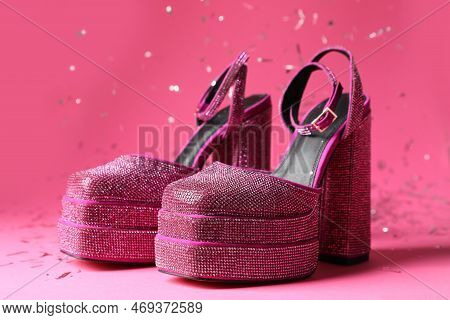 Fashionable Punk Square Toe Ankle Strap Pumps And Confetti On Pink Background. Shiny Party Platform 