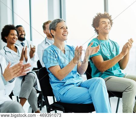 Portrait Of A Young Doctors And Nurses In Audiance During A Seminar In A Board Room Or During An Edu