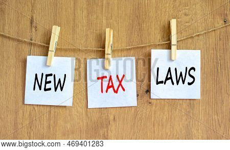New Tax Laws Symbol. Concept Words New Tax Laws On White Paper On Clothespin On A Beautiful Wooden T
