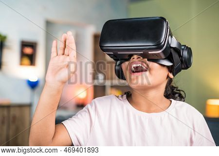 Smiling Teenger Girl Kid With Vr Or Virtual Reality Headset Saying Hi On Video Call On Metaverse At 