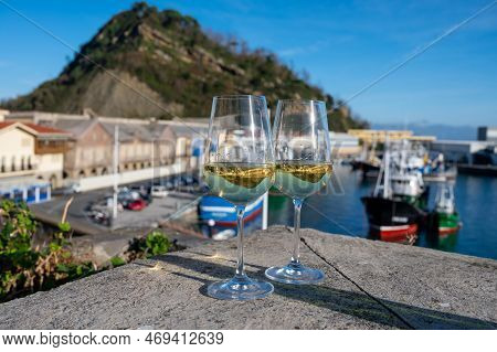 Tasting Of Txakoli Or Chacolí Slightly Sparkling Very Dry White Wine Produced In Spanish Basque Coun