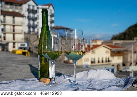 Tasting Of Txakoli Or Chacolí Slightly Sparkling Very Dry White Wine Produced In Spanish Basque Coun