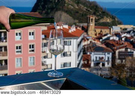Tasting Of Txakoli Or Chacolí Slightly Sparkling Very Dry White Wine Produced In Spanish Basque Coun