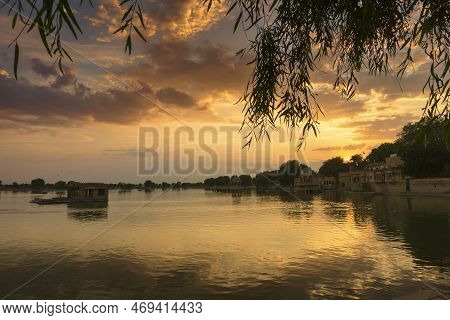 Nice Sunset At Gadisar Lake, Jaisalmer, Rajasthan, India. Setting Sun And Colorful Clouds In The Sky