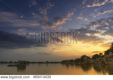 Nice Sunset At Gadisar Lake, Jaisalmer, Rajasthan, India. Setting Sun And Colorful Clouds In The Sky