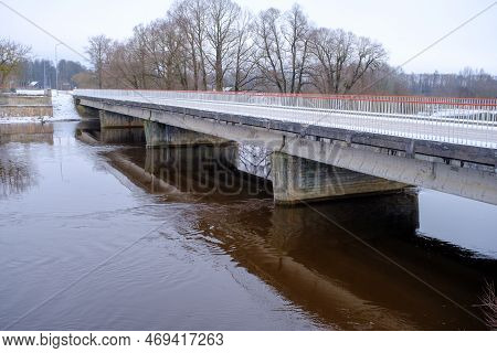 River Aiviekste In Vidzeme, Latvia In Winter Time. High Water Level In The River, Dark January Day.
