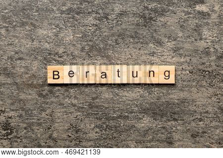 Beratung Word Written On Wood Block. Beratung Text On Cement Table For Your Desing, Concept.