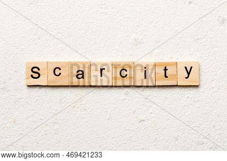 Scarcity Word Written On Wood Block. Scarcity Text On Cement Table For Your Desing, Concept.