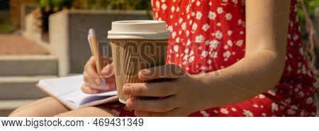 Unrecognizable Young Woman In Red Dress Drinking Coffee From Craft Paper Cup Writing Gratitude Journ
