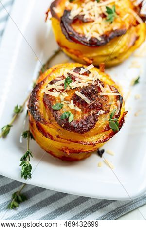 Baked Thin Potato Slices With Ghee, Garlic, Parmesan And Thyme Close-up. Top View.