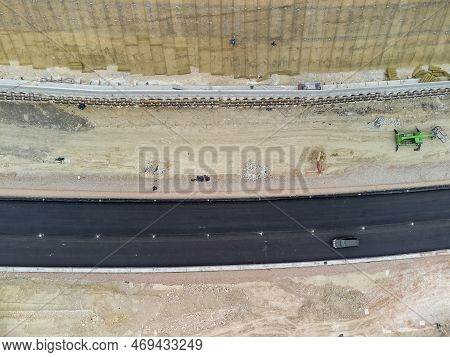 Mountain Road Constraction. Workers Reinforce The Slope Over The New Road. Road Construction In Prog