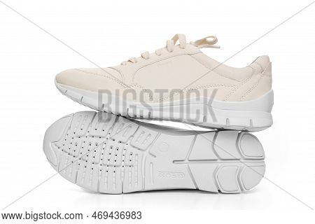 Leather Sneakers With Lacing And Perforated Sole On A White Background.