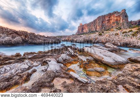Gorgeous Evening Seascape Of Isolidda Beach On San Vito Cape. Popular Travel Destination Of Mediterr
