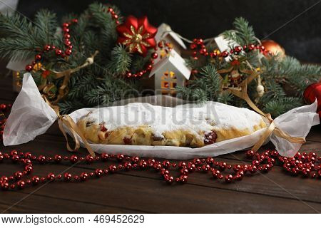 Traditional Stollen With Decoration On Wooden Background