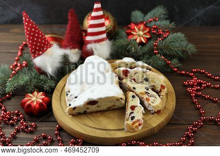 Traditional Stollen With Decoration On Wooden Background