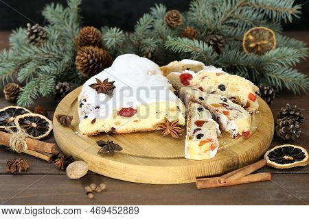 Traditional Stollen With Decoration On Wooden Background