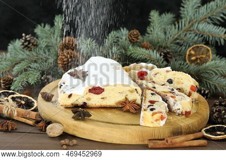 Traditional Stollen With Decoration On Wooden Background