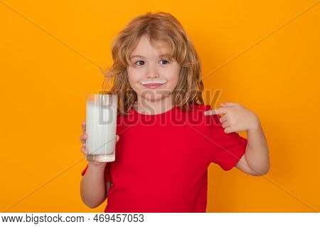 Healthy Food For Kids. Organic Milk. Cute Little Child With Glass Of Milk On Studio Color Background