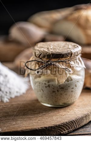 Rye Sourdough Ripened In A Jar Together With Flour On A Cutting Board