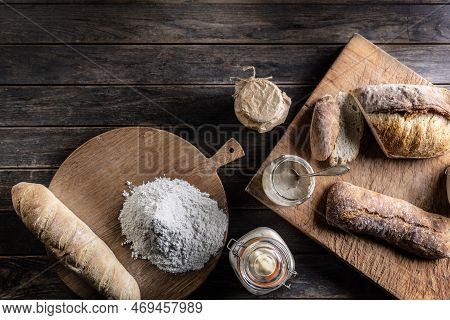 Bakery Concept, Flour Bread And Glasses With Rye Sourdough On The Table. - Top Of View