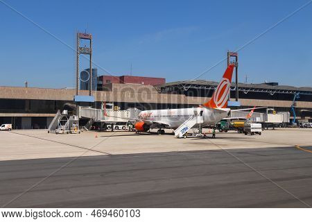 Curitiba, Brazil - October 9, 2014: Workers Handle Gol Airline Boeing 737-800 At Curitiba Airport, B
