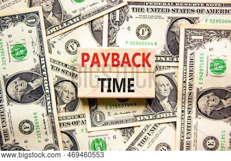 Payback Time Symbol. Concept Words Payback Time On Wooden Blocks. Beautiful Background From Dollar B