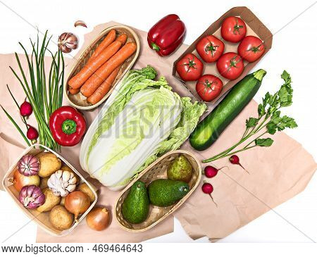 A Variety Of Organically Grown Vegetables Are Stacked Diagonally On Rough Paper Or In Packaging. Hea