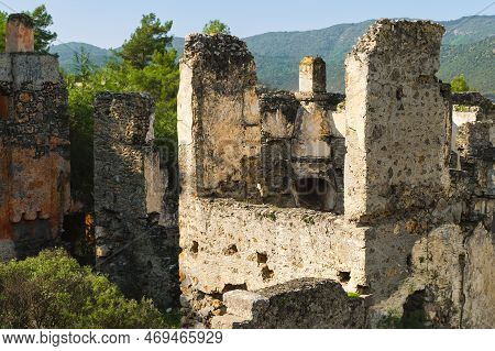 Ruins Of The Abandoned Greek City Of Levissi Near The Village Of Kayakoy In Fethiye Turkey, Against 