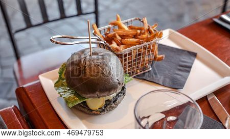 Vegan Burger With French Fries. Burger With Plant Based Meat Cheese. Lunch Is On The Table. Close-up