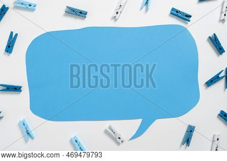 Important Messages. Sticker Lying On White Desk With Clotherspins. Crutial Informations Memos. White