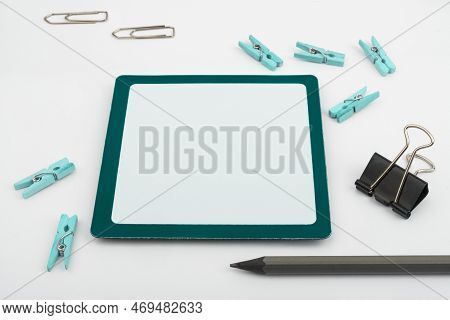 Important Messages. Sticker Lying On White Desk With Clotherspins. Crutial Informations Memos. White