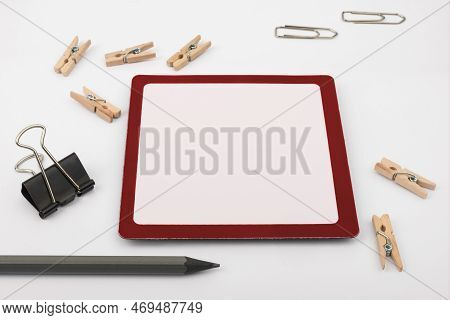 Important Messages. Sticker Lying On White Desk With Clotherspins. Crutial Informations Memos. White
