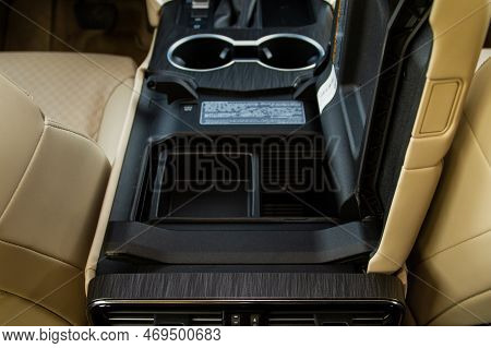 Car Armrest Opened. Opened Armrest In The Car For Driver.