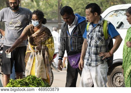 Puttaparthi, Andra Pradesh - India - January 21.2023: A Man On The Local Indian Vegetable Market In 
