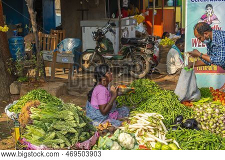 Puttaparthi, Andra Pradesh - India - January 21.2023: A Women Selling Vegetables On The Local Indian