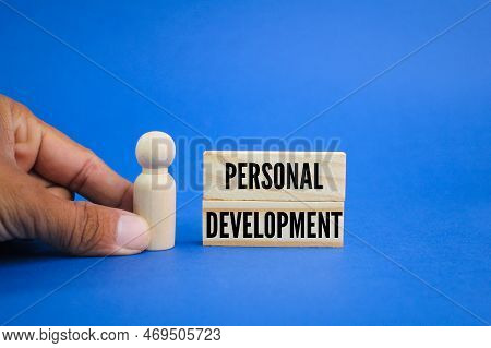 Wooden Figure With The Word Personal Development. The Concept Of Self-development. The Concept Of Se