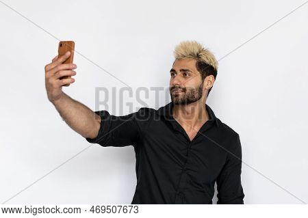 Winsome Young Man Taking Selfie. Male Caucasian Model With Brown Eyes, Ombre Painted Hair And Beard 