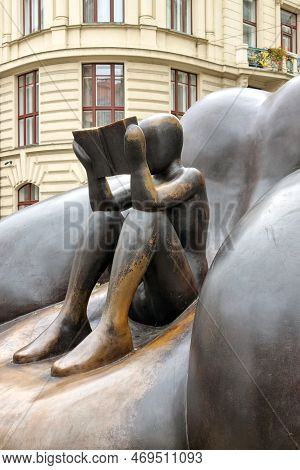 Prague, Czech Republic, October 15, 2022: Reader In An Armchair - Sculpture In Kafka Square.