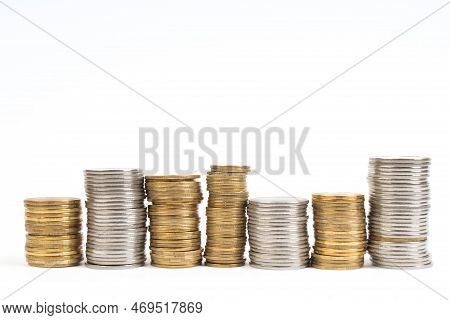 Gold Towers Made Out Of Gold And Silvery Coins, Stack Isolated On White.