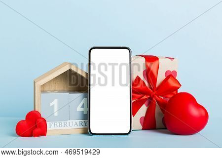Mobile Phone With Blank Screen On Colored Background With Hearts, Calendar And Gift Box, Valentine D