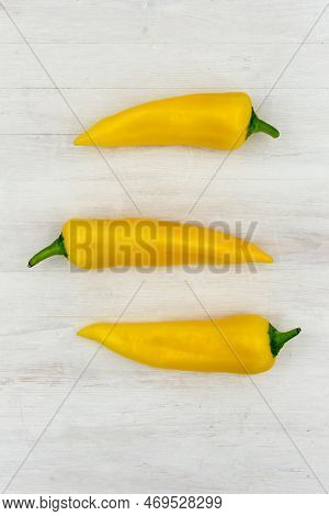 Yellow Ramiro Pepper Is Prepared For Use In The Preparation Of A Salad Or Other Dish. Three Beautifu