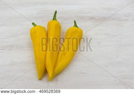 Yellow Ramiro Pepper Is Prepared For Use In The Preparation Of A Salad Or Other Dish. Three Beautifu