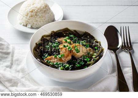 Korean Seaweed Soup With Meat In A White Bowl And Boiled Rice. Birthday Soup. Traditional Korean Cui