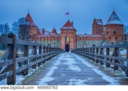 Lithuanian Travel Ideas. Trakai Medieval Castle With Towers Of Red Bricks And Wooden Connecting Brid