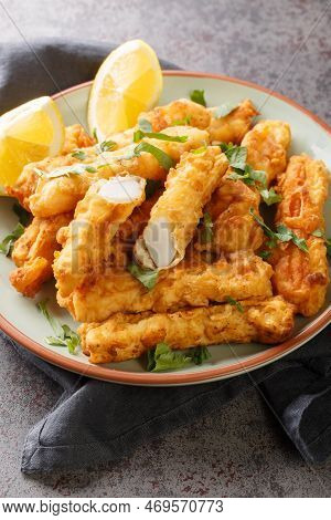 Fried Spanish Squid Rabas Fritas Closeup On The Plate On The Table. Vertical