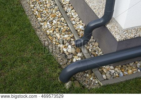 Gutter Elbow Leads Rainwater Into The Garden. Drainage System.