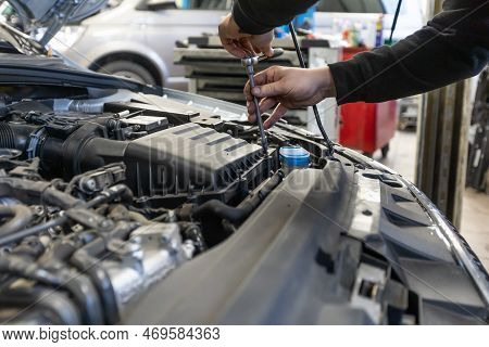 Professional Car Servis Man Changing The Air Filter By The Car Engine, Car Service Concept