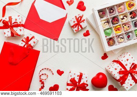Top View Photo Of St Valentine Day Decor Shopping, Bag, Envelope, Gift, Box, Candy And Red Heart On 