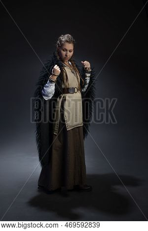 An Authoritative, Self-confident Woman In A Viking-style Fantasy Costume. Skirt With Shirt And Long 